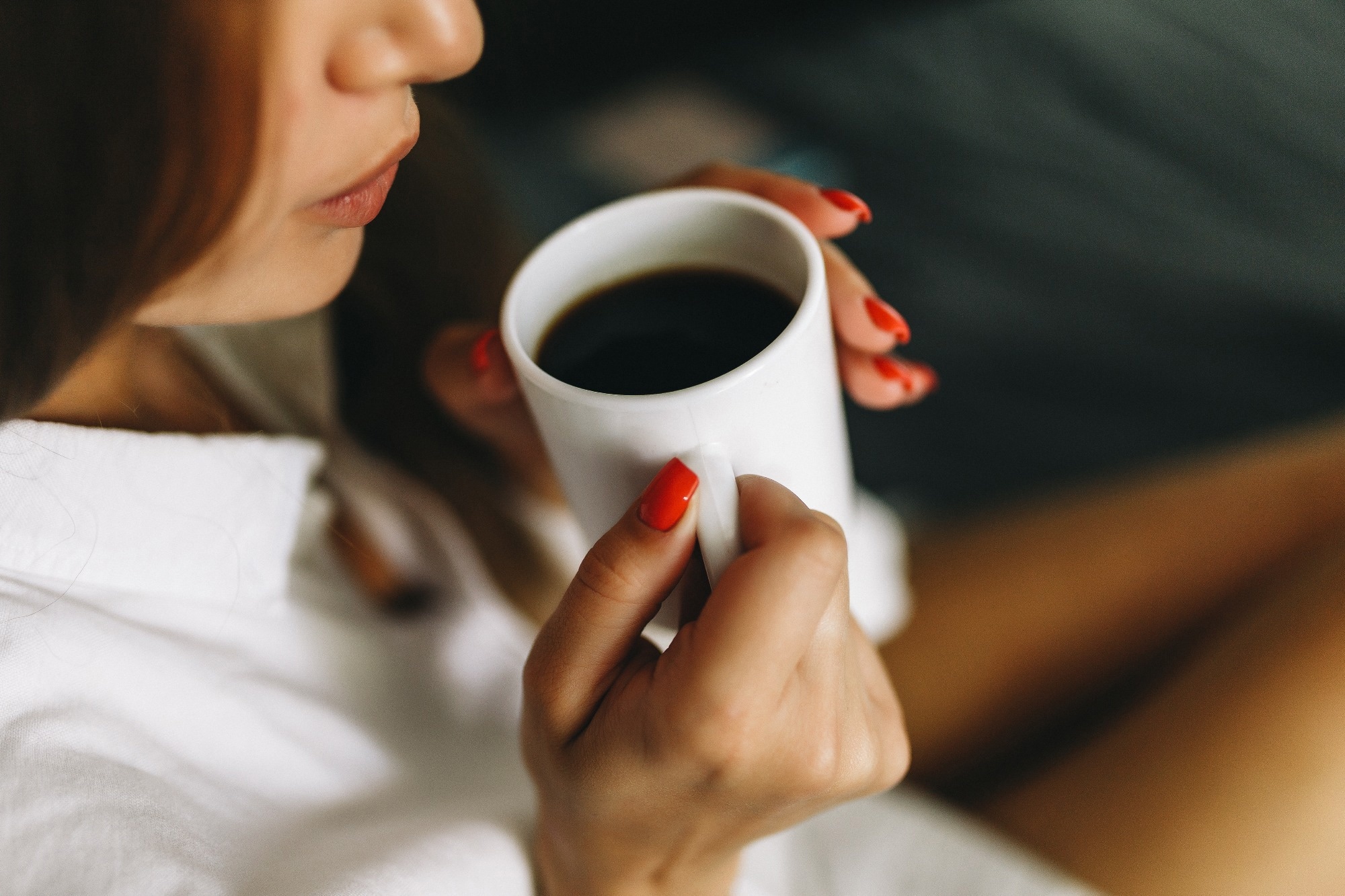 Woman drinks black coffee