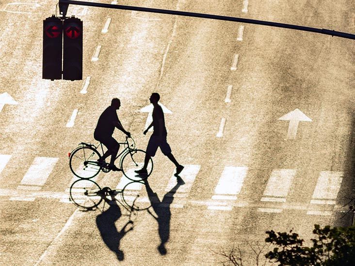 cyclist and pedestrian on zebra crossing