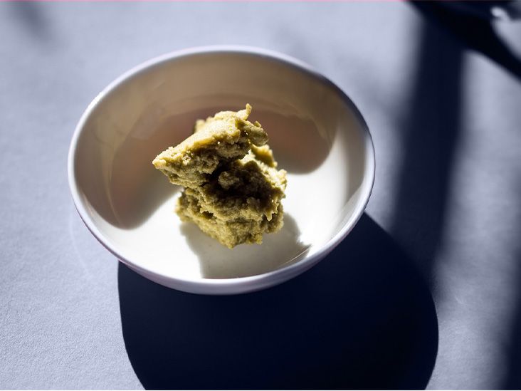 A dollop of wasabi paste on a plate.