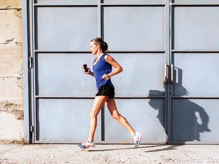 Older female jogging outdoors