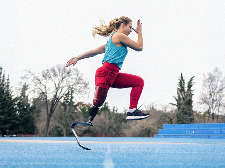 a woman with prosthetic leg doing strength training workout outdoor