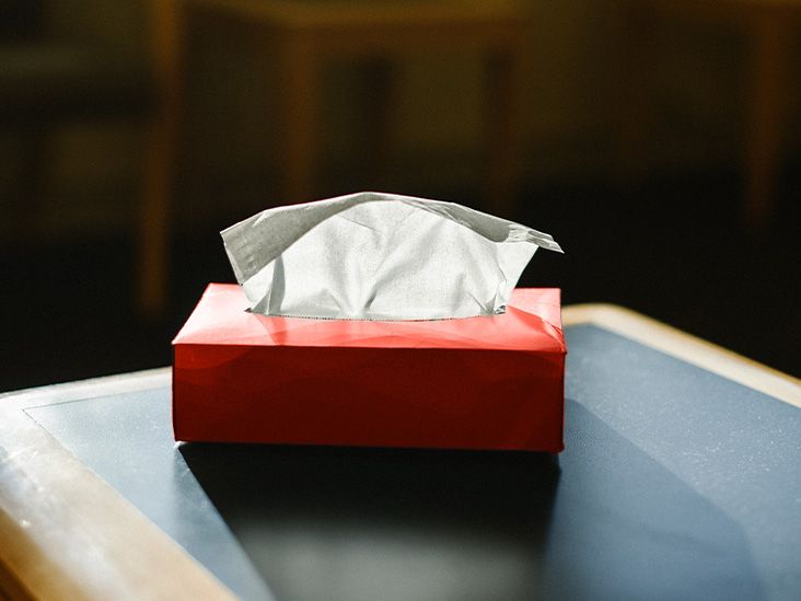 A table with a tissue box