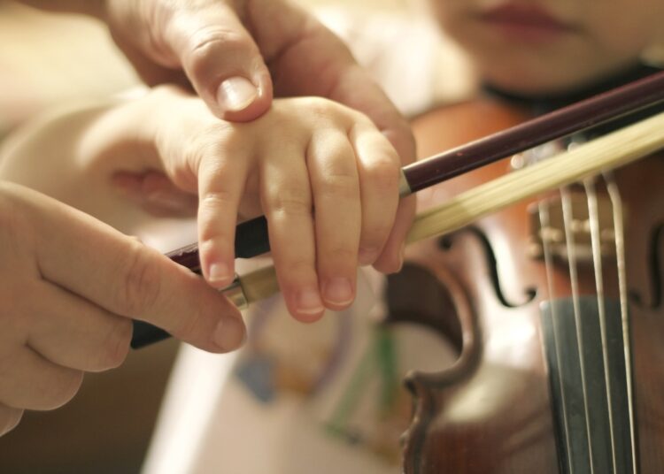 Study: Long-term music instruction is partially associated with the development of socioemotional skills. Image Credit: Photo joy / Shutterstock