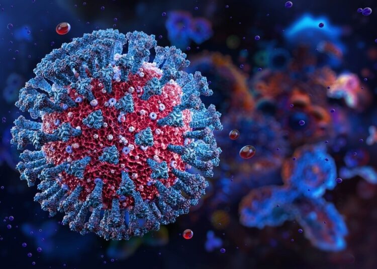 A highly detailed 3D-rendered illustration of a virus particle, with a red core covered in blue spike-like protein structures. The surrounding environment is dark with floating particles, giving a microscopic view of the virus in a biological setting.