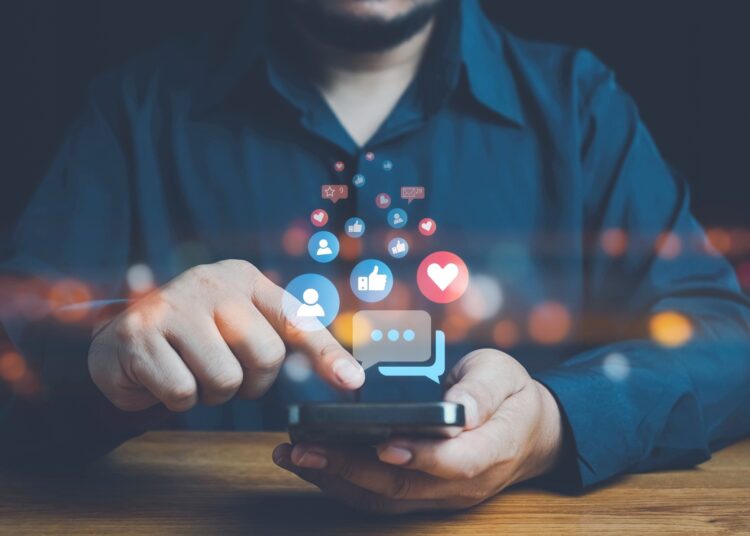 Social media and digital online concept, man using smart phone.