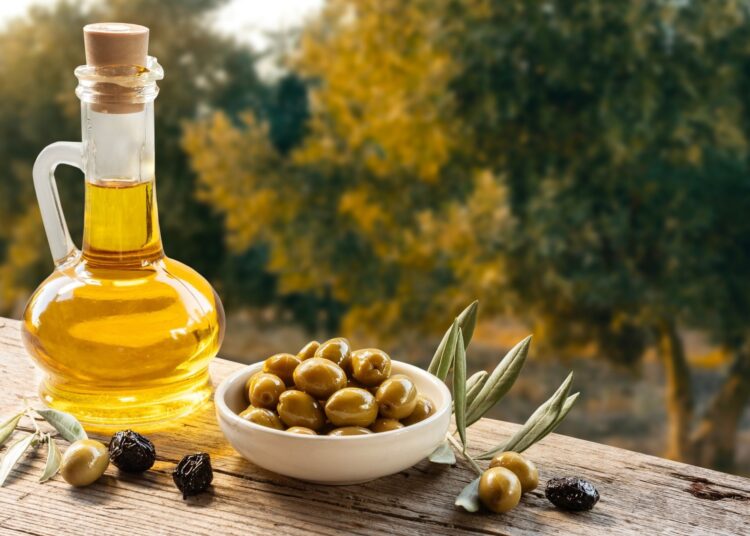 Green olive oil and olive oil concept