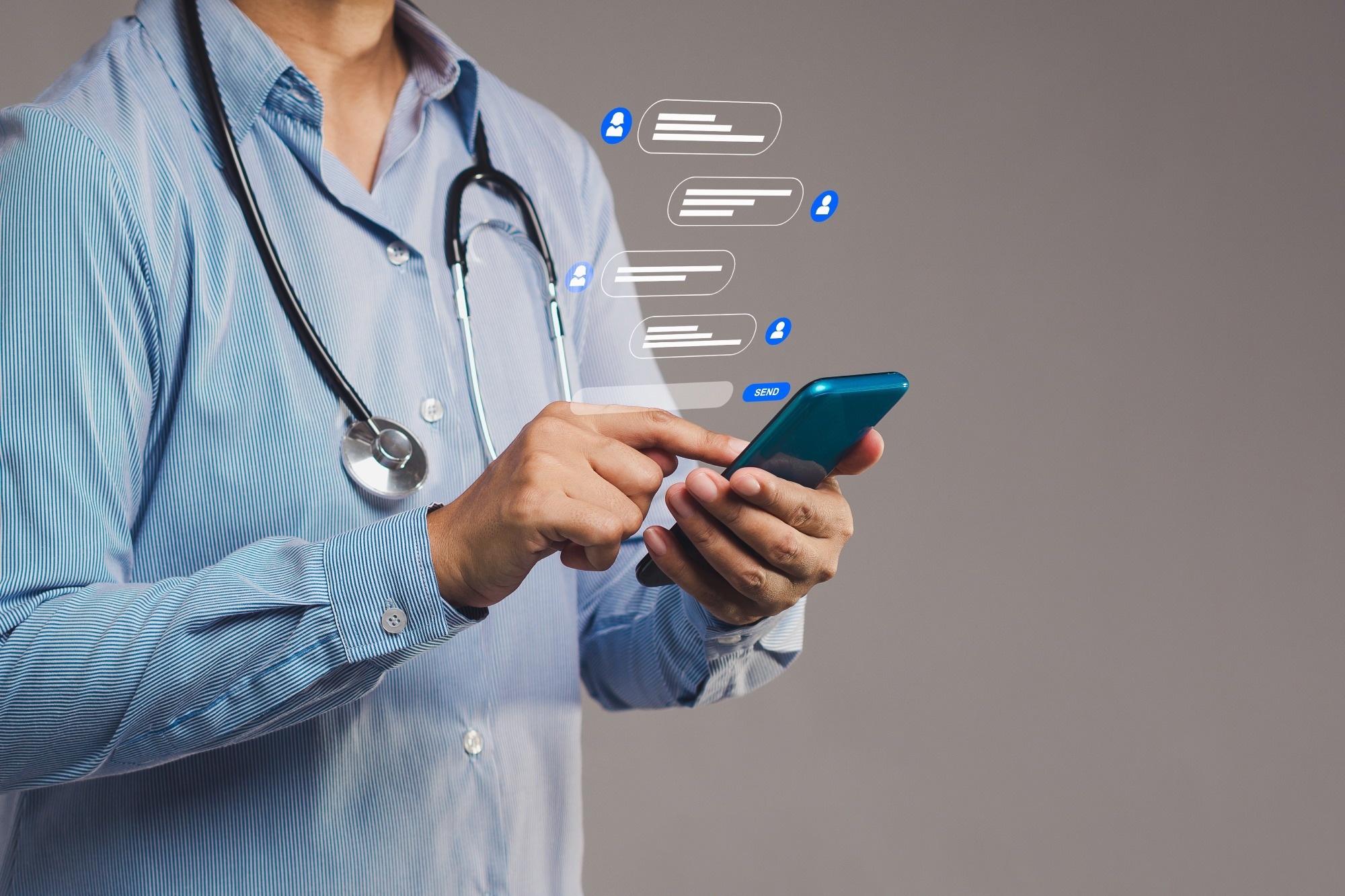 Close-up of a doctor interacting with smartphone, showing messaging symbols for online healthcare