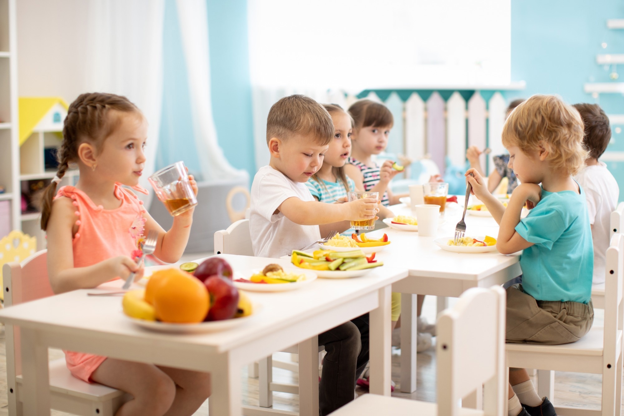 Group of children eating healthy food