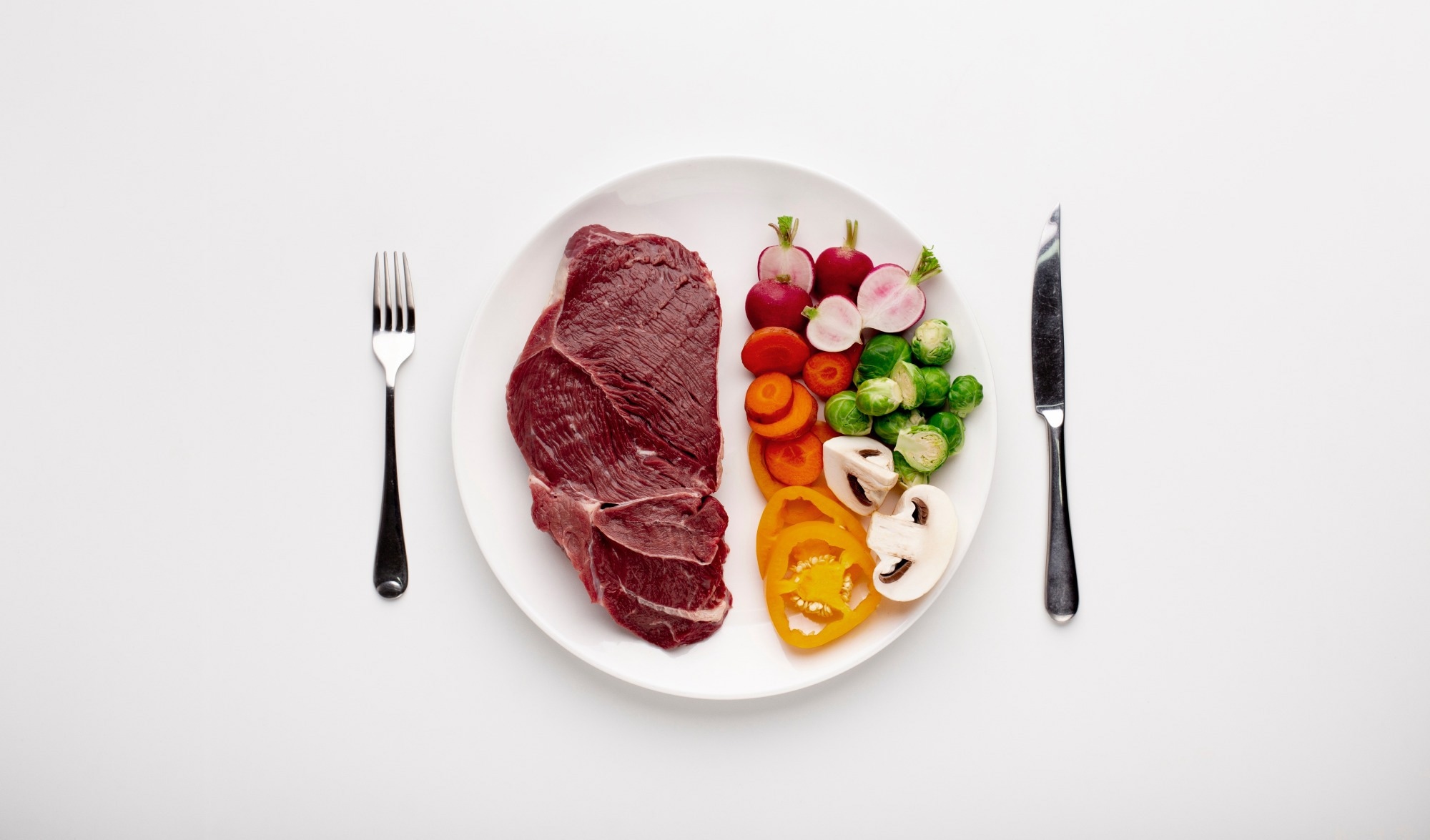 Served plate with meat and vegetables, top view
