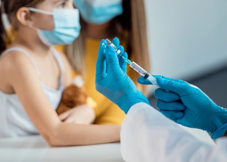 Close-up of pediatrician preparing a vaccine