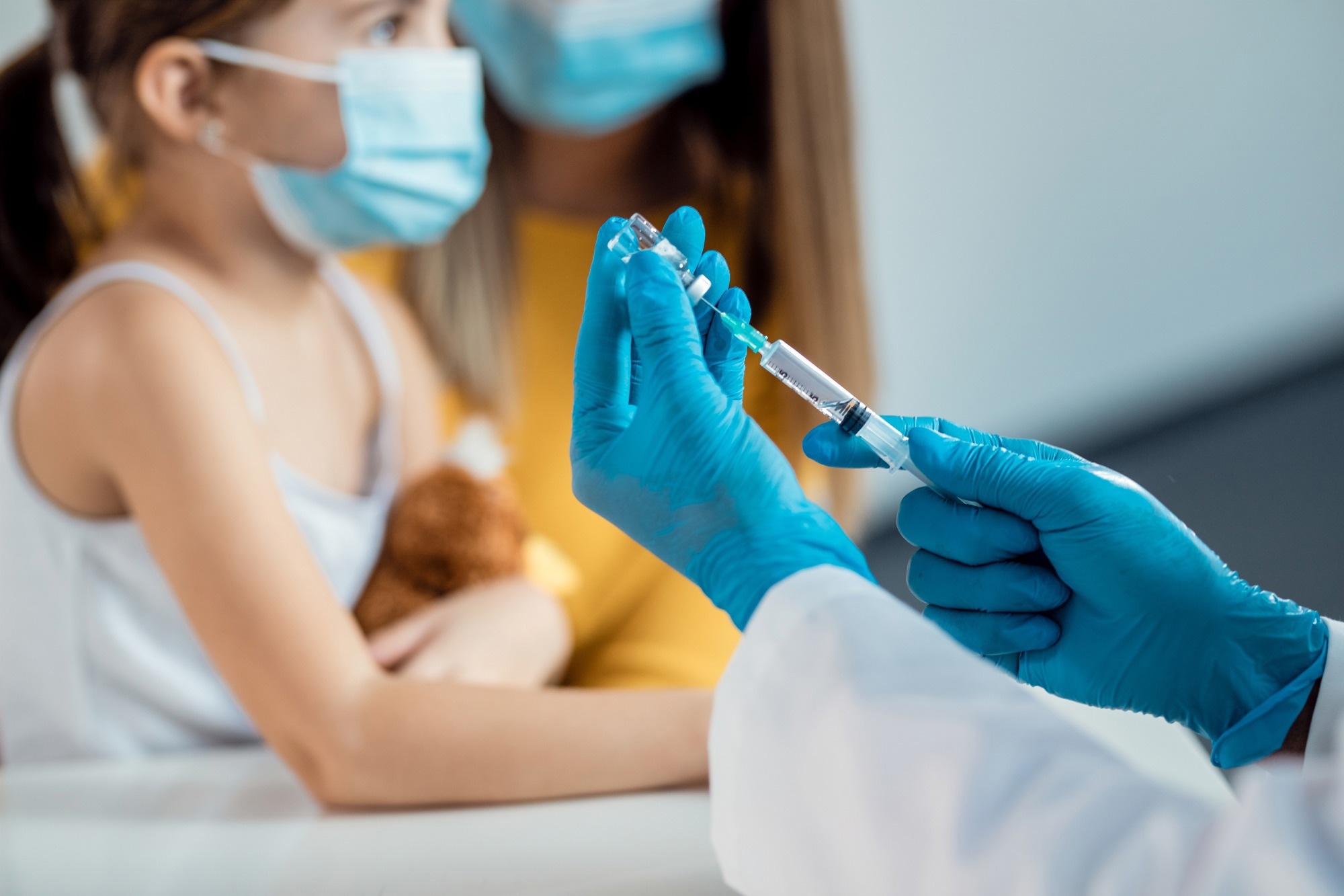 Close-up of pediatrician preparing a vaccine