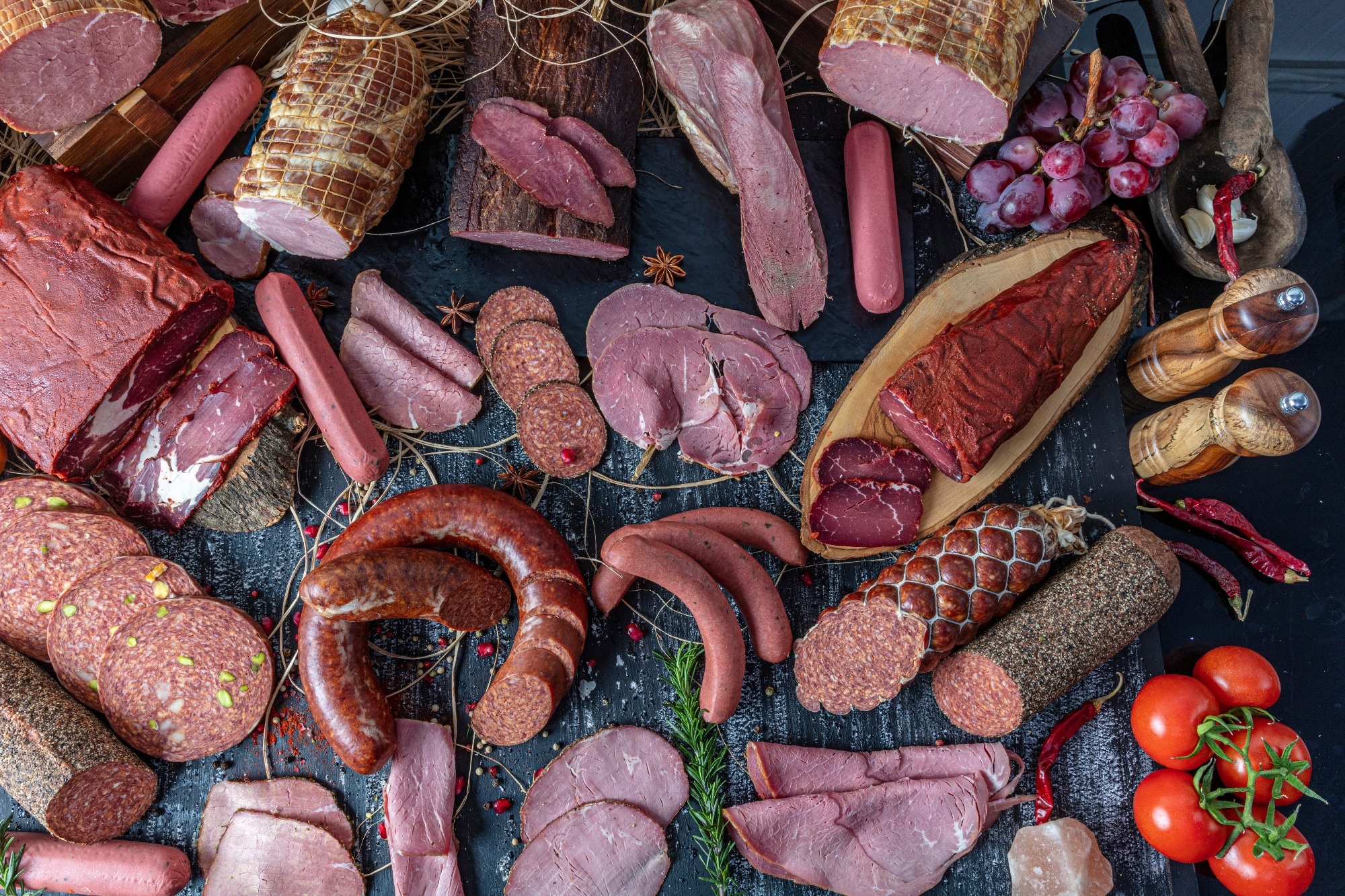 Variety of processed cold red meat products.