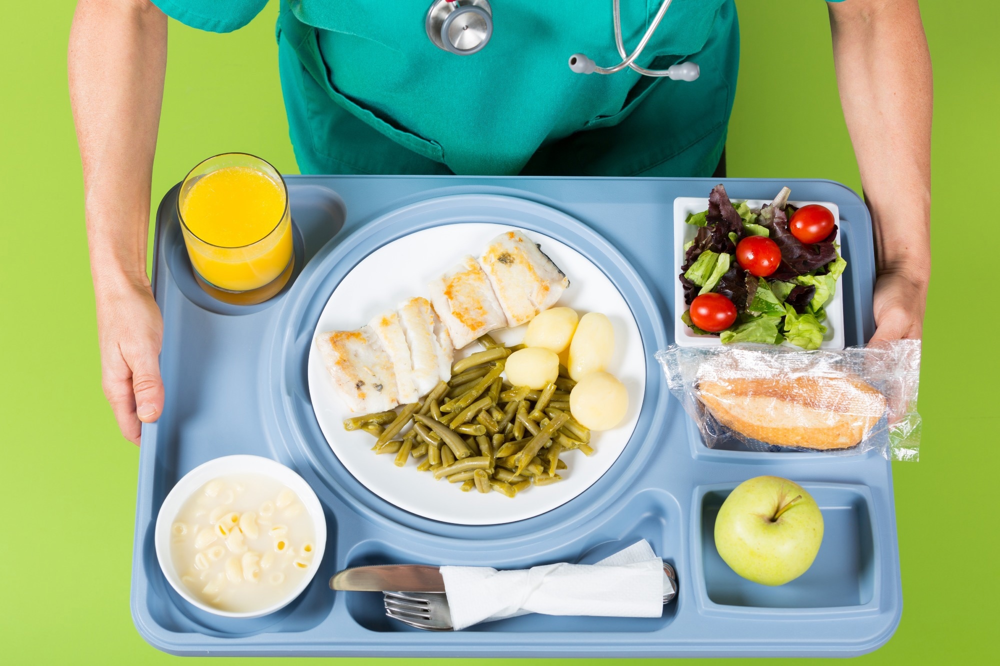 Health professional with a tray of food
