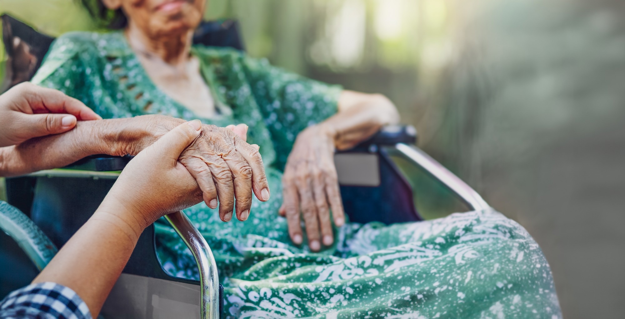 Elderly asian woman on wheelchair at home with daughter take care