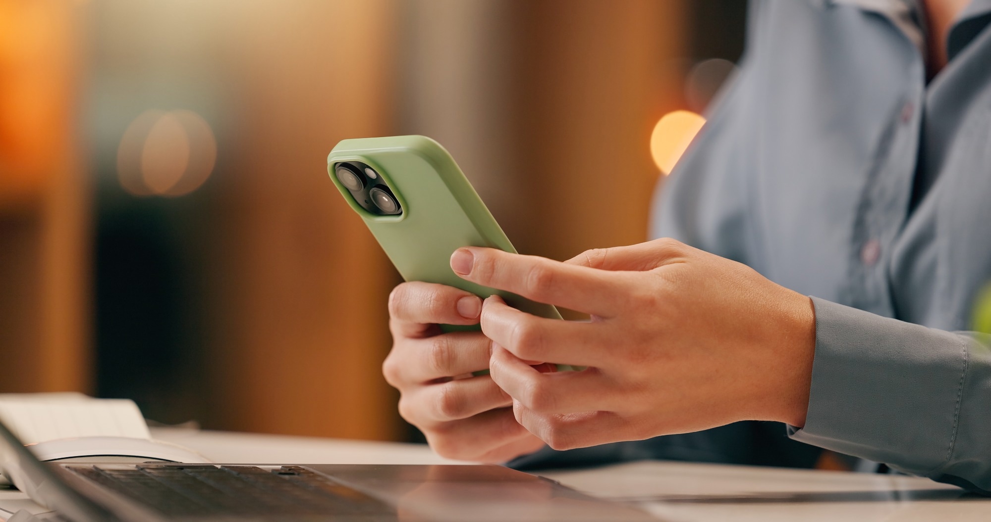 Hands with phone texting