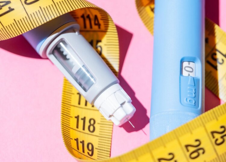Flat lay of two Ozempic pens on a pink background. Concept of diabetes treatment, weight loss medication, and modern healthcare. Two injectors dosing pens for subcutaneous injection