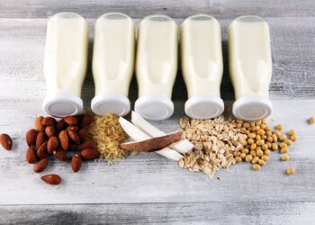 Various vegan plant based milk alternatives and ingredients. Dairy free milk substitute drink, healthy eating.