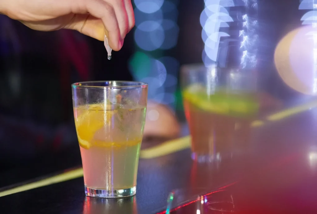 Understanding drink spiking and needling experiences and reporting in the UK. Image Credit: PeopleImages / Shutterstock